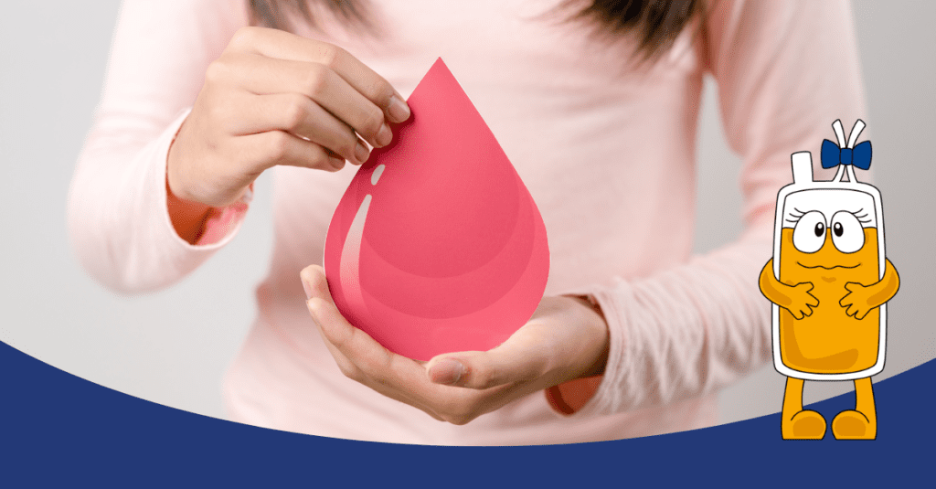 Egy rózsaszín ruhás személy két kézzel tart egy nagy, piros vércsepp alakú papírt, szimbolizálva a vérplazma adományozás fontosságát.